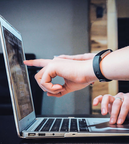 Entrepreneurs collaborating on a laptop